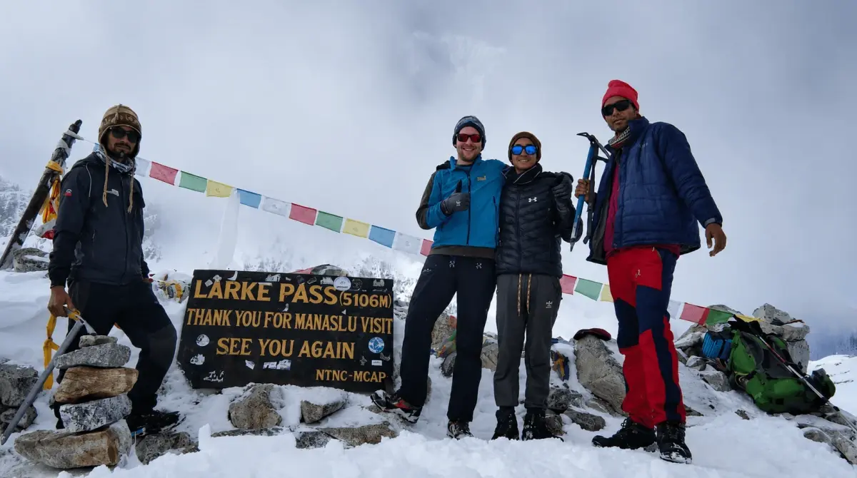 Manaslu Circuit Trek at Larkya La Pass 5106m with trekkers in snowy Nepal Himalaya – Thrill Himalaya