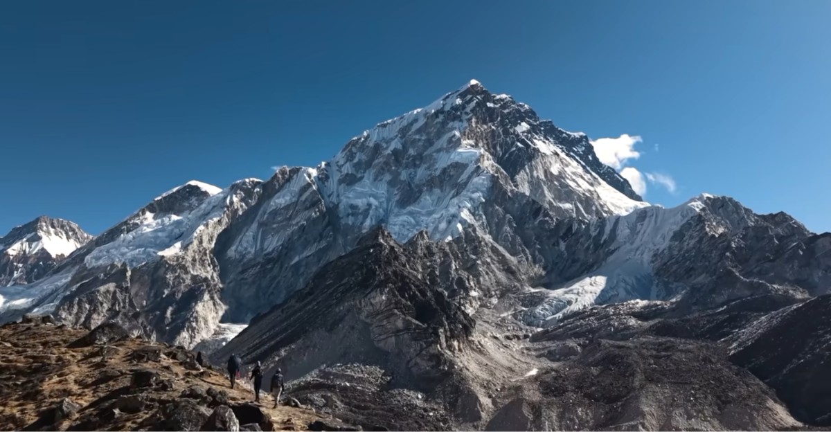 Panoramic view of snow-capped Himalayan mountains along the Everest Base Camp trekking route.