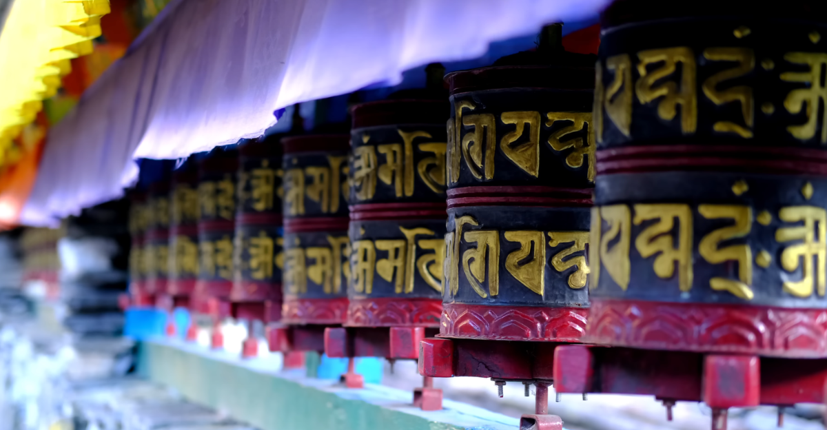 Traditional Buddhist prayer wheels along a Himalayan trekking route in Nepal