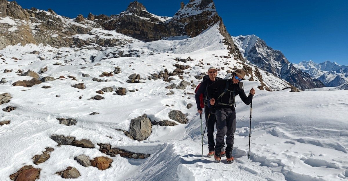 Two trekkers walking along the safe mountain trail toward Everest Base Camp